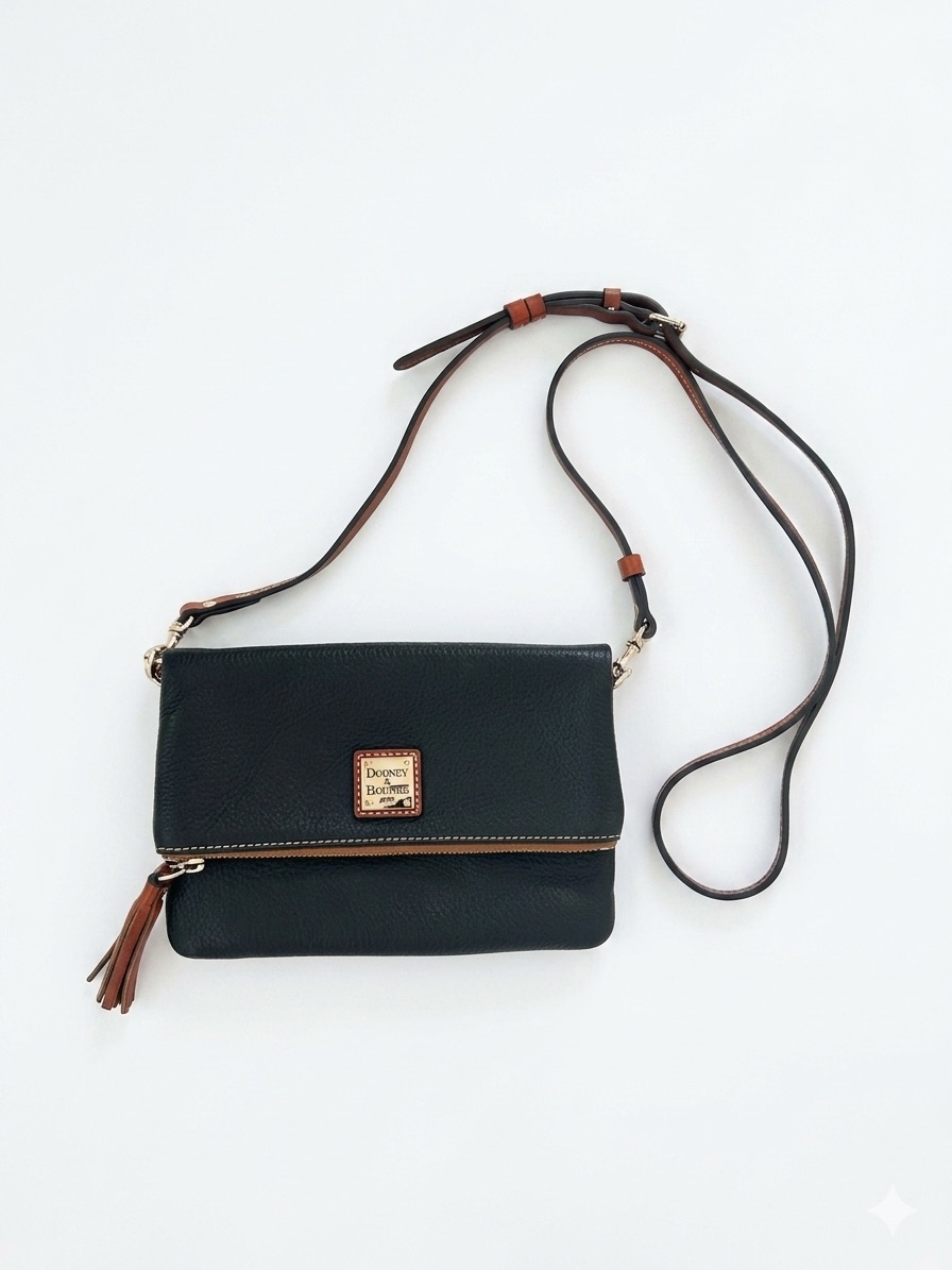 Dooney & Bourke Black Fold-Over Pebbled Leather Crossbody Bag With Brown Tassel